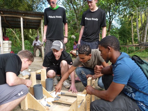 NC students participating in an International Field Studies trip over Reading Week teach locals how to build treadle pumps, which use pedal power for greenhouse irrigation.